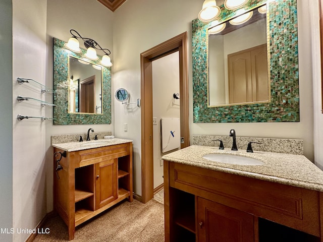 211 Monterey Dr, Clinton, MS 39056 - bathroom featuring two vanities and baseboards
