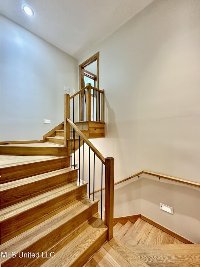 211 Monterey Dr, Clinton, MS 39056 - stairs with recessed lighting, baseboards, and wood finished floors