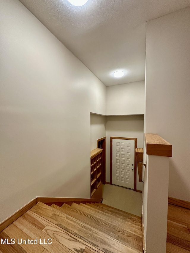 211 Monterey Dr, Clinton, MS 39056 - staircase featuring baseboards and wood finished floors