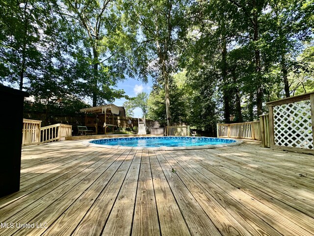 211 Monterey Dr, Clinton, MS 39056 - view of pool with a wooden deck
