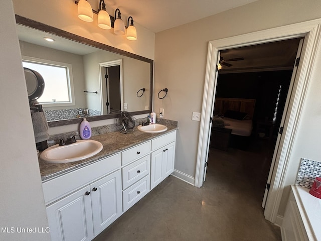 bathroom with vanity and concrete flooring