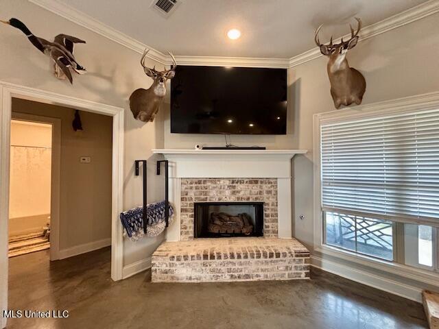 living room featuring crown molding and a brick fireplace