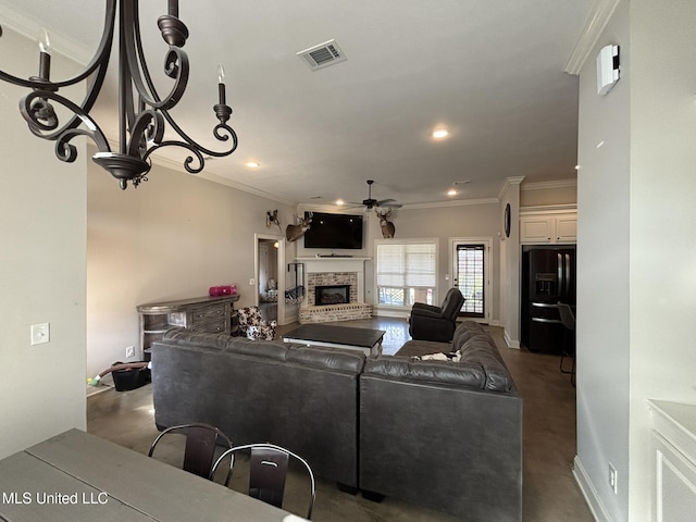 living room with crown molding, a fireplace, and ceiling fan