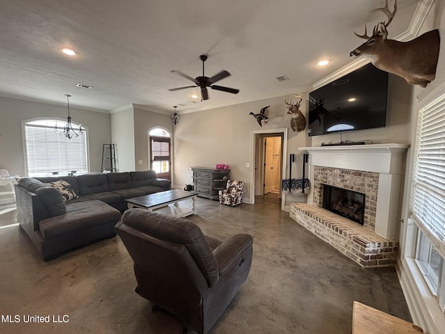 living room featuring ceiling fan, a healthy amount of sunlight, ornamental molding, and a brick fireplace