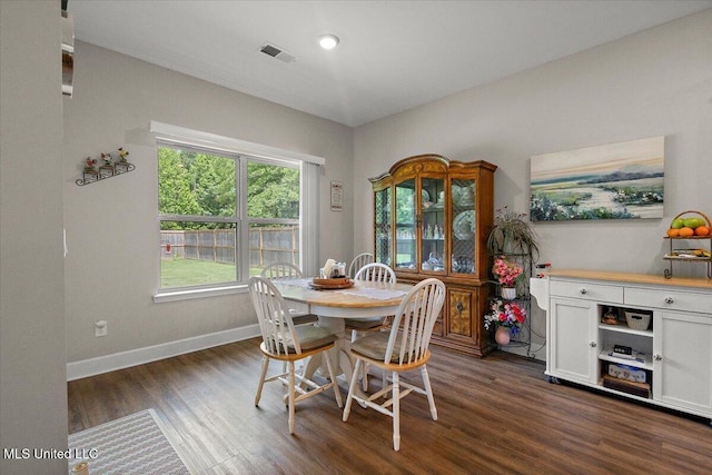 203 Vision Cv, Canton, MS 39046 - dining area featuring dark wood-style floors and baseboards