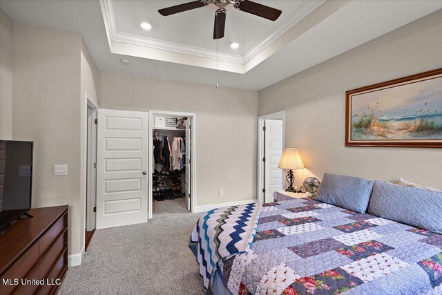 203 Vision Cv, Canton, MS 39046 - carpeted bedroom with crown molding, recessed lighting, a spacious closet, a raised ceiling, and a closet