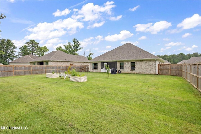 203 Vision Cv, Canton, MS 39046 - fenced backyard with a vegetable garden