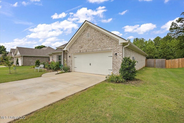 203 Vision Cv, Canton, MS 39046 - view of front of house featuring a garage, brick siding, and driveway