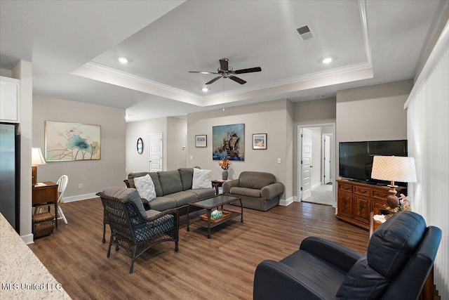 203 Vision Cv, Canton, MS 39046 - living area featuring a raised ceiling, ceiling fan, dark wood-style flooring, ornamental molding, and recessed lighting