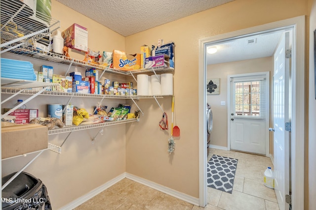 pantry featuring washer / clothes dryer