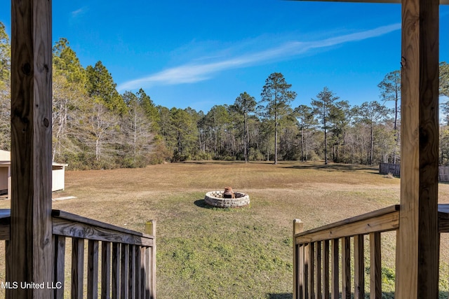 view of yard with an outdoor fire pit