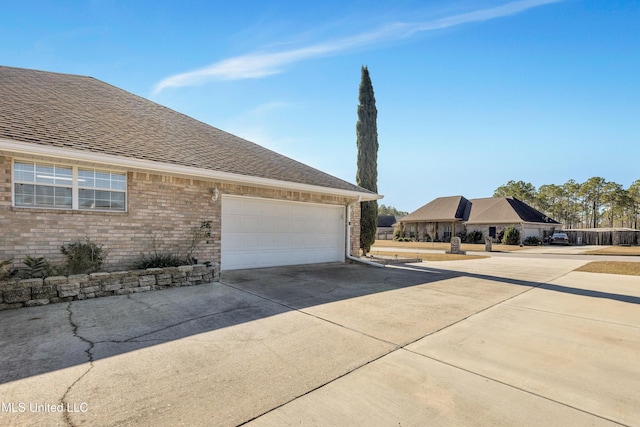 view of property exterior with a garage