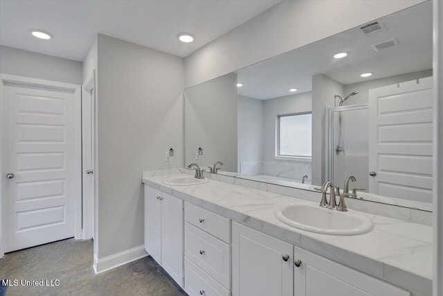 946 Filmore Dr, Brandon, MS 39042 - bathroom featuring a stall shower, double vanity, a garden tub, and recessed lighting