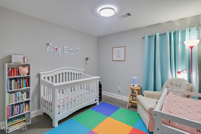 946 Filmore Dr, Brandon, MS 39042 - bedroom featuring a nursery area and carpet floors