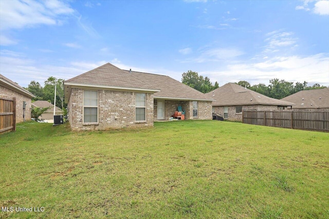 946 Filmore Dr, Brandon, MS 39042 - back of property featuring brick siding and a shingled roof