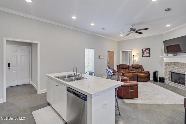946 Filmore Dr, Brandon, MS 39042 - kitchen with stainless steel dishwasher, ceiling fan, white cabinetry, recessed lighting, and a center island with sink