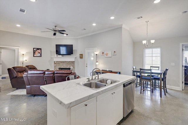 946 Filmore Dr, Brandon, MS 39042 - kitchen with finished concrete floors, a brick fireplace, dishwasher, ceiling fan, and recessed lighting