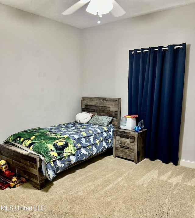 bedroom with ceiling fan and carpet flooring