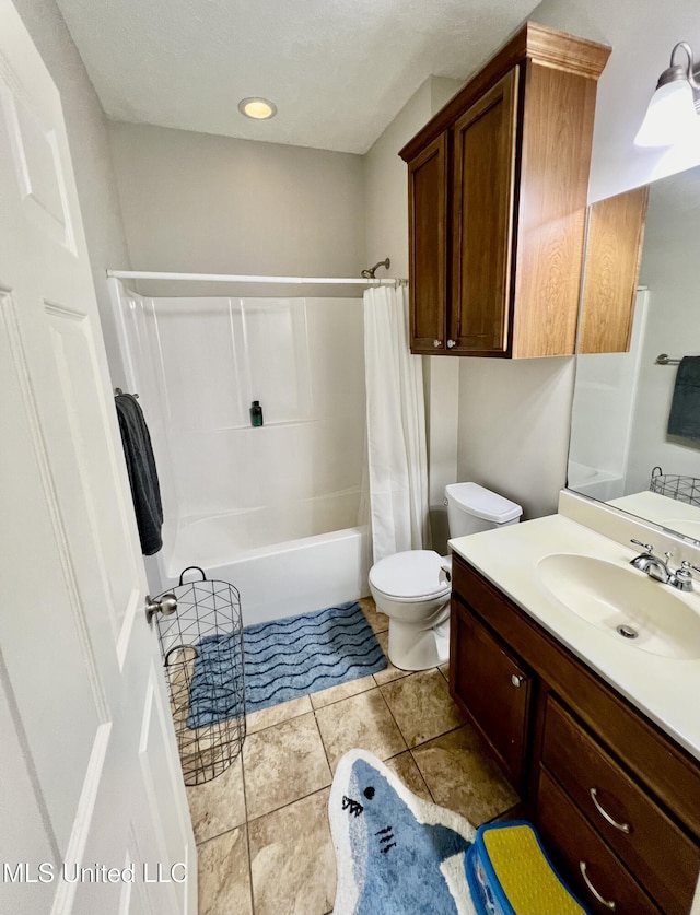 full bathroom featuring toilet, tile patterned flooring, shower / tub combo, and vanity