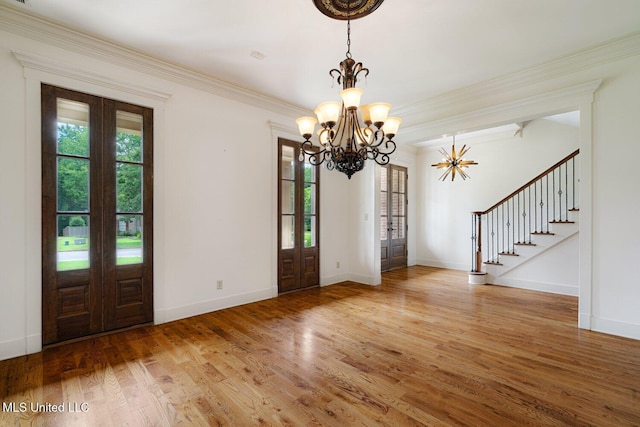 4050 Robinson Xing, Olive Branch, MS 38654 - entryway with a chandelier, wood finished floors, baseboards, stairway, and ornamental molding