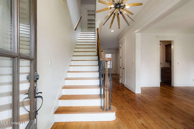 4050 Robinson Xing, Olive Branch, MS 38654 - staircase with crown molding, baseboards, wood finished floors, recessed lighting, and ceiling fan