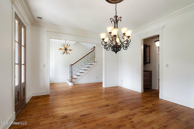 4050 Robinson Xing, Olive Branch, MS 38654 - empty room with a chandelier, light wood finished floors, stairs, ornamental molding, and baseboards