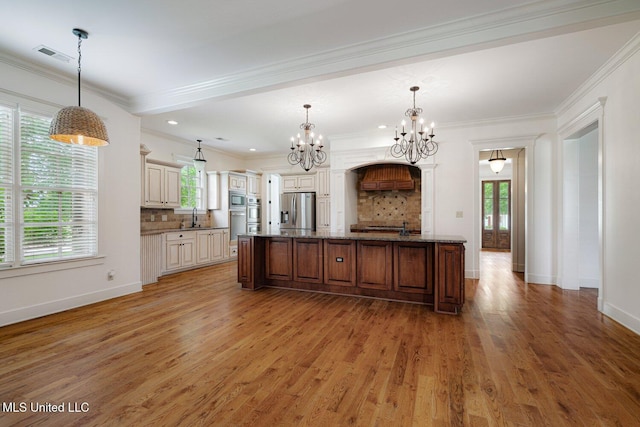 4050 Robinson Xing, Olive Branch, MS 38654 - kitchen featuring appliances with stainless steel finishes, a sink, a chandelier, light wood-type flooring, and crown molding