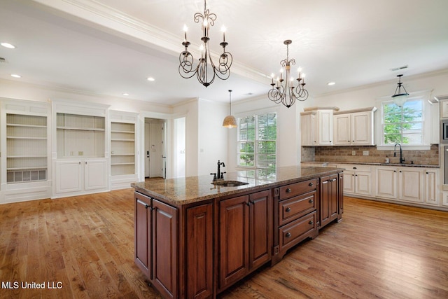 4050 Robinson Xing, Olive Branch, MS 38654 - kitchen with crown molding, a sink, an island with sink, healthy amount of natural light, and recessed lighting