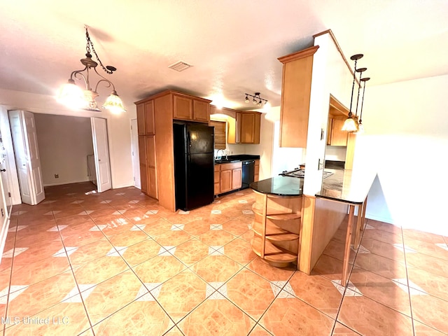 kitchen with black appliances, sink, light tile patterned flooring, pendant lighting, and an inviting chandelier