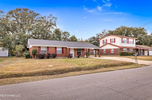 view of property with a carport and a front lawn