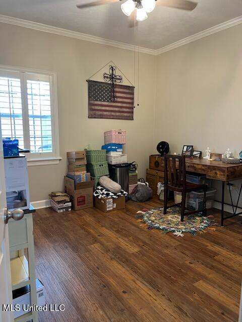 office featuring baseboards, ceiling fan, ornamental molding, and wood finished floors