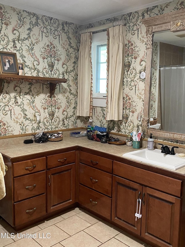 interior space with tile patterned floors, vanity, crown molding, and wallpapered walls