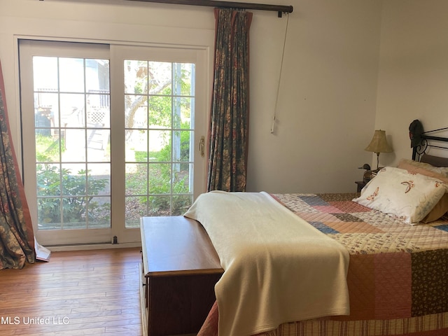 bedroom with wood-type flooring