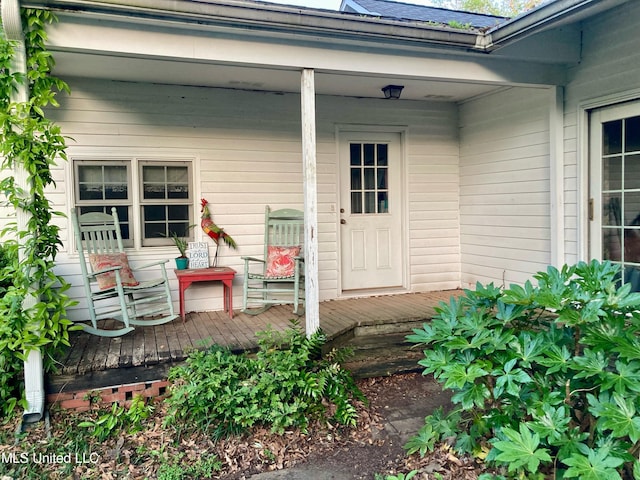 property entrance with a deck
