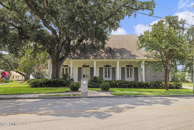 view of front of home featuring a porch and a front lawn