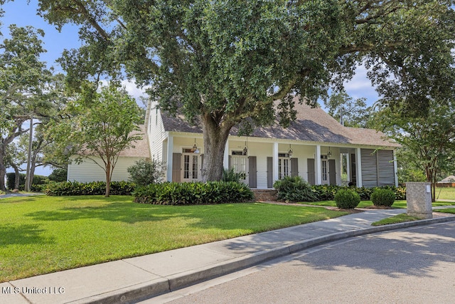 view of front of home featuring a front lawn and a porch