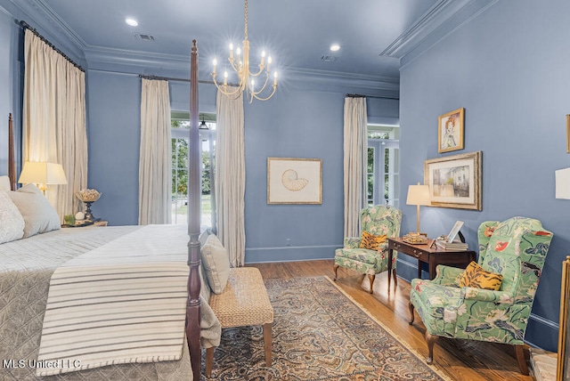 bedroom with crown molding, multiple windows, and wood-type flooring