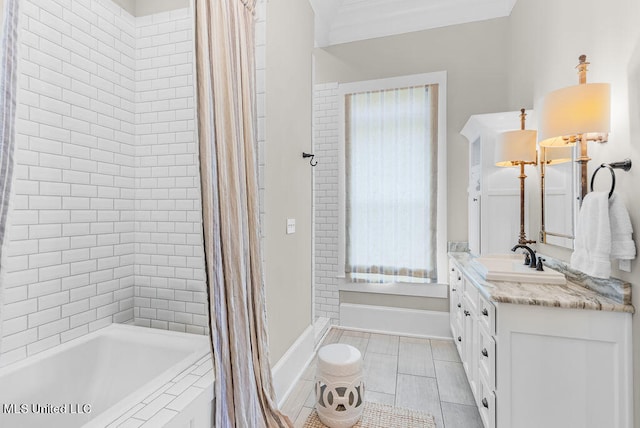 bathroom with vanity, ornamental molding, and shower / bath combo