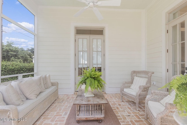 sunroom / solarium with ceiling fan