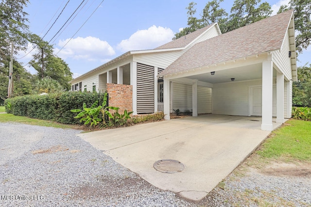 view of side of property featuring a carport