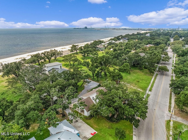 aerial view with a water view and a beach view