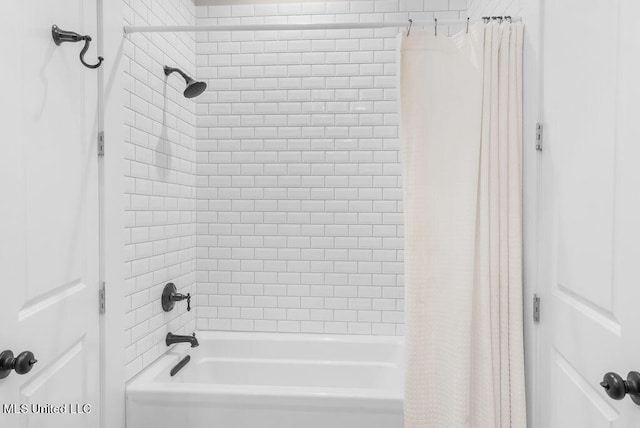 bathroom with shower / tub combo with curtain