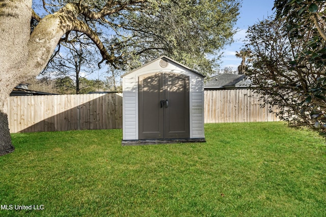 view of shed featuring a fenced backyard