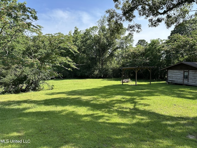 1628 Dry Creek Rd, Magee, MS 39111 - view of green lawn featuring a pergola
