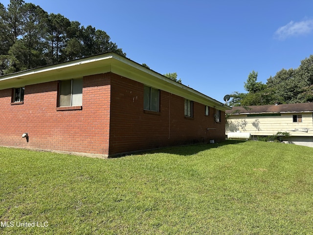 1628 Dry Creek Rd, Magee, MS 39111 - view of side of property featuring a yard and brick siding