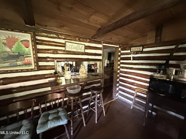 1628 Dry Creek Rd, Magee, MS 39111 - indoor bar with wooden walls, lofted ceiling, wood ceiling, and dark wood-type flooring