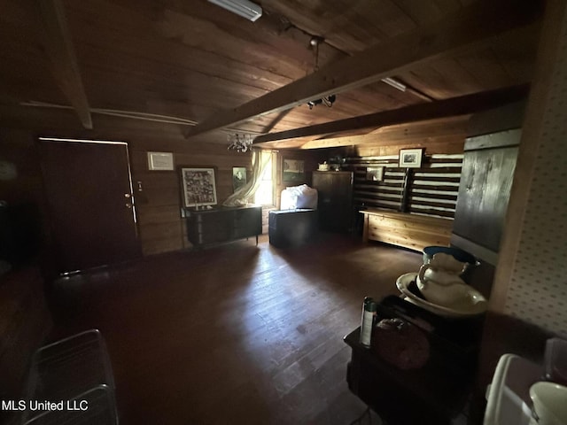 1628 Dry Creek Rd, Magee, MS 39111 - living area featuring wooden ceiling with exposed beams, wallpapered walls, wood finished floors, and wood walls