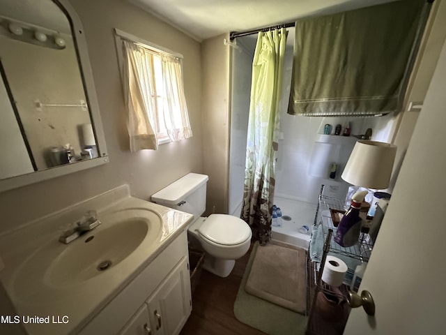1628 Dry Creek Rd, Magee, MS 39111 - full bathroom featuring toilet, vanity, a shower stall, and wood finished floors