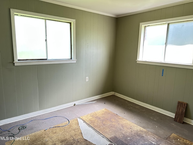1628 Dry Creek Rd, Magee, MS 39111 - unfurnished room featuring healthy amount of natural light, baseboards, and ornamental molding
