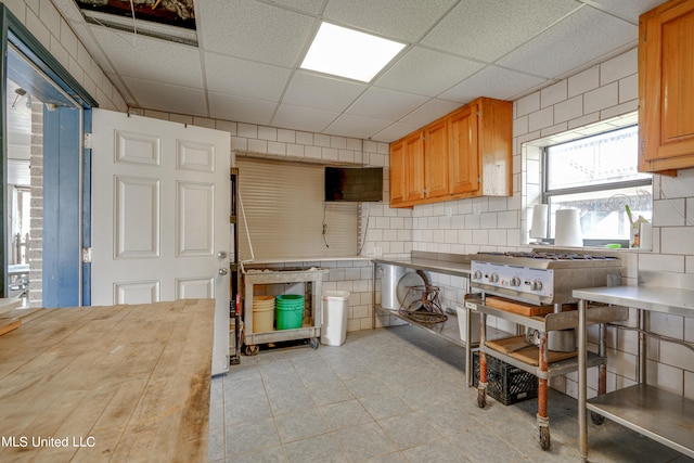 kitchen featuring a paneled ceiling